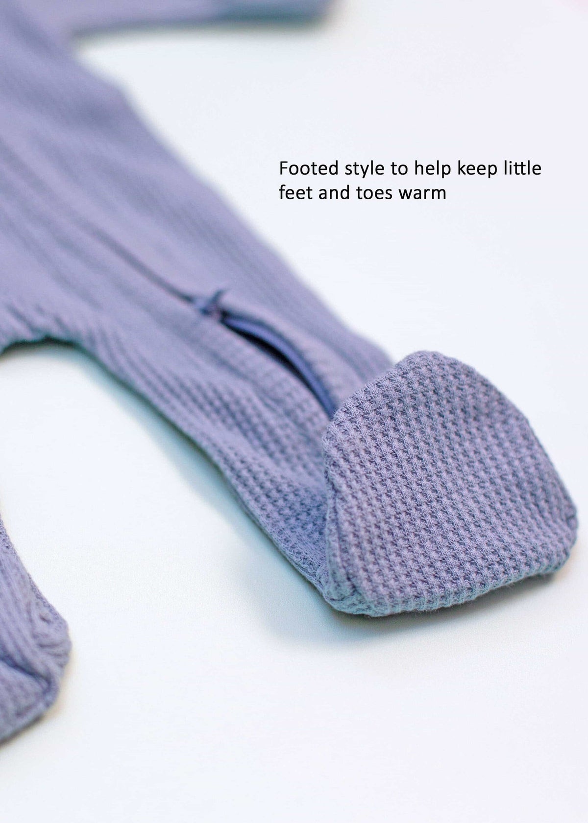Zipped blue premature sleepsuit, close-up of zip and mitts