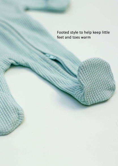 Mint green waffle zip sleepsuit with integrated mitts on a premature baby